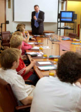 Former Clerk of the Senate speaking to schoolchildren in Parliament House